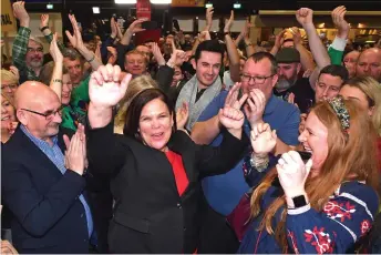  ?? — AFP photo ?? McDonald (centre) celebrates with her supporters after she takes the Dublin Central constituen­cy on the first count in the RDS centre in Dublin.