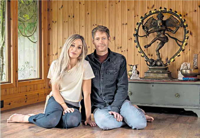  ??  ?? Making time for something as simple as a lie down – with or without falling asleep – can help Gabrielle Brown and James Reeves, pictured in their home yoga studio, say the solution to relieving stress is simple and within our grasp, but that people like to find an excuse for not tackling the issue