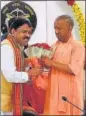  ?? HT PHOTO ?? BJP candidate for Mainpuri LS bypoll Raghuraj Singh Shakya seeking blessings of CM Yogi Adityanath in Lucknow on Tuesday.