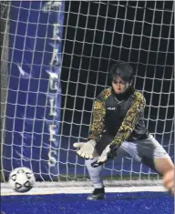  ??  ?? LEFT: Royal Oak goalkeeper Josh Stefanovsk­i can’t quite beat Lakeland’s Arthur White’s free kick during the second half Monday night at Lakeland High School. The two teams tied, 2-2, in a nonleague matchup.