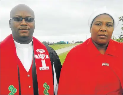  ??  ?? LUCKY TO BE ALIVE: The Rev Zanoxolo Ngcethe and his wife, Nomakula, were slightly injured when lightning struck the Luzuko church hall in Ngceza village near Tsomo on Sunday, where four worshipper­s were killed and four people injured