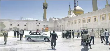  ?? Ebrahim Noroozi Associated Press ?? POLICE patrol after four gunmen and suicide bombers struck at the shrine of Ayatollah Ruhollah Khomeini.