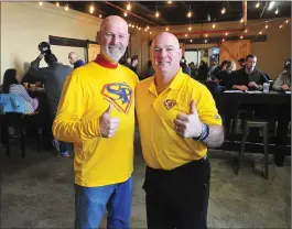  ??  ?? Rick LaBreche, left, and Bo Mathews, take time out for a photo during a fundraiser event at Ravenous Brewery in Cumberland Saturday, to benefit the annual Torch Run Super Plunge for Special Olympics.