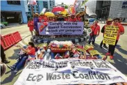  ?? Maria Salvador Tan / AFP/Getty Images ?? Environmen­tal activists, belonging to the EcoWaste coalition, protest outside the Canadian Embassy in Manila, demanding Canada take back its trash.