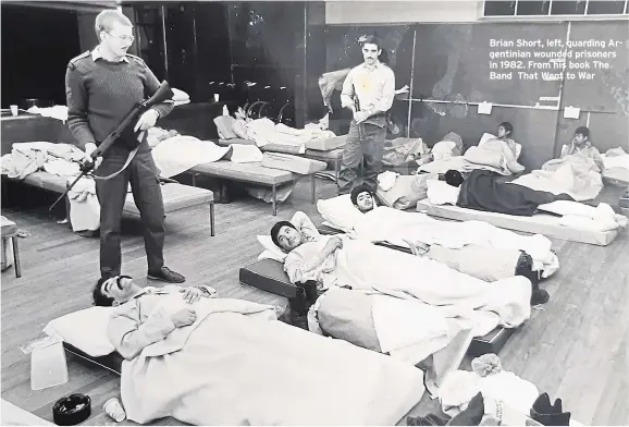  ?? ?? Brian Short, left, guarding Argentinia­n wounded prisoners in 1982. From his book The Band That Went to War