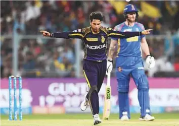  ?? AFP ?? Kolkata Knight Riders’ Kuldeep Yadav celebrates after taking a Rajasthan Royals wicket on Tuesday. Yadav said he was inspired by legend Warne after his spell helped KKR beat Royals.