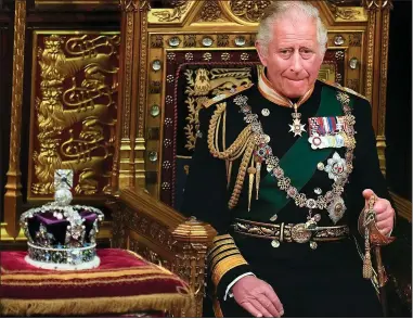  ?? ?? SON AND HEIR: Charles sits by the Queen’s crown in the Lords at the State Opening of Parliament on May 10