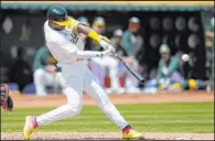  ?? Jeff Chiu The Associated Press ?? Athletics leadoff batter Esteury Ruiz connects for a two-run homer during the third inning of Oakland’s win over St. Louis on Wednesday.