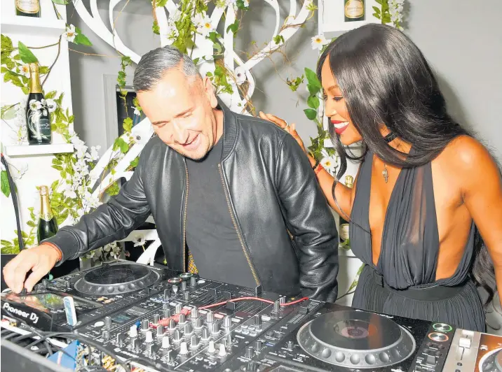  ?? PHOTO / GETTY IMAGES ?? Djing with Naomi Campbell at the opening party for L’eden by Perrier-jouet, in London, 2016.