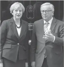  ?? CARL COURT/GETTY IMAGES ?? Prime Minister Theresa May and European Commission President JeanClaude Juncker’s reported spat over the price of Brexit may weaken struggling Britons’ enthusiasm for Brexit.