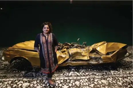  ?? Divya Mehra, Prairies and the North VINCE TALOTTA/TORONTO STAR PHOTOS ?? A long, slender room with the crushed remains of a golden Jaguar Vanden Plas is the jarring, immediate introducti­on to Mehra and it’s an experience that draws you closer. Mehra, whose parents emigrated from India to Winnipeg, grew up with difference...