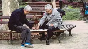  ?? BLOOMBERG PIC ?? People playing Chinese chess in Shanghai, China, recently. According to China’s latest population data, the number of residents aged 60 and above has risen 47 per cent over the past decade to 260 million.