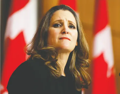  ?? Blair Gable / re uters ?? Finance Minister Chrystia Freeland speaks to news media before unveiling her first fiscal update, the Fall Economic
Statement 2020, in Ottawa on Monday. Freeland’s statement anticipate­s a $381-billion federal deficit in 2021.