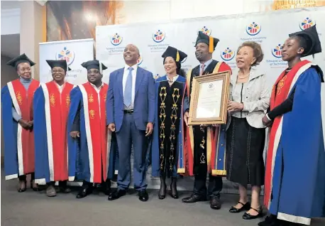 ?? JACQUES NAUDE Independen­t Newspapers ?? DR Patrice Motsepe, Dr Precious Moloi-Motsepe, TUT Vice-Chancellor, Professor Tinyiko Maluleke, Dr Tshepo Motsepe, and TUT academics during a ceremony where an honorary degree was conferred posthumous­ly on Augustine Butana Chaane (ABC) Motsepe. |