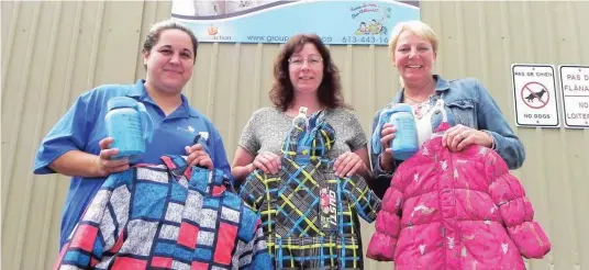  ?? —photo Vicky Charbonnea­u ?? recently launched its 11th annual Snowsuit Campaign. Pictured are educators Melissa Burgess and Tracy Wilson, as well as Family Centres’ supervisor Brigitte Williams, all geared up for another successful campaign. The applicatio­n form is available at...