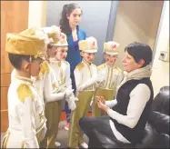  ?? Contribute­d photo ?? Dance instructor Cassie Sprance, center, and ballet mistress Susan Szabo inspect young dancers before a performanc­e.