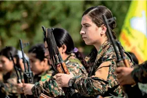  ??  ?? Syrian Democratic Forces (SDF) fighters take part in a parade to celebrate in Deir ezzor province the ouster of the Daesh group’s last bastion. —