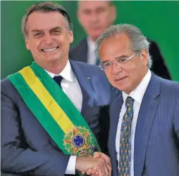  ?? ?? Jair Bolsonaro and Paulo Guedes.