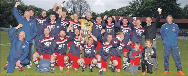  ?? Photos: Stephen Lawson. Match report Derek Black ?? A jubilant Oban Saints squad celebrate after their 2-1 win over St Joseph’s FP in the final of the Jimmy Marshall Cup last Friday evening at Millburn Park, Alexandria.