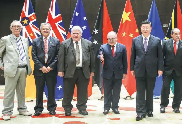  ?? FENG YO ?? President Xi Jinping poses for a group photo with leaders of Pacific island countries, which have all establishe­d diplomatic relations with China, in Port Moresby, the capital of Papua New Guinea, Nov 16, 2018.