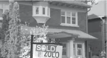  ?? GRAEME ROY, THE CANADIAN PRESS ?? A sold sign in front of a west-end Toronto home.