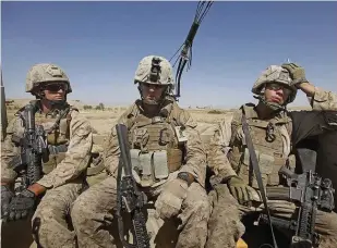  ??  ?? Outside the wire US Marines on patrolinHe­lmand Province, 2010. The constant threat of Improvised 'Zplosive &evices has had a corrosive eʘect on modern soldiers’ mental wellbeing