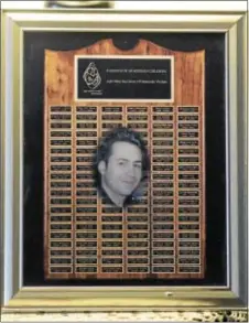  ?? TOM KELLY IV — DAILY TIMES ?? A plaque from the Parents of Murdered Children display the photo and name of Thomas Childs.