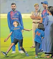  ?? AP ?? Virat Kohli watches Ashish Nehra's son imitate the bowling action of his father (right) at the end of Wednesday’s T20 match.