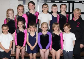  ??  ?? Under-9 gymnasts from Gorey, Craanford and BBBCR with coach, Angie Dooley, at the county finals held in Gorey.