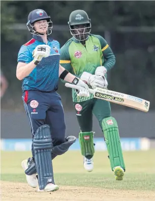  ?? FRED THORNHILL/THE CANADIAN PRESS ?? Toronto Nationals Steve Smith, left, who was shunned for cheating in a cricket test match, led his new team to a victory in the inaugural Global T20 Canada match at Maple Leaf Cricket Club.