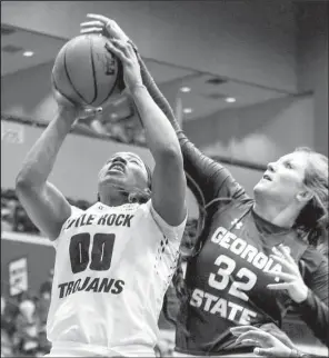  ?? Arkansas Democrat-Gazette/MITCHELL PE MASILUN ?? UALR’s Ronjanae DeGray (00) is fouled by Georgia State’s Haley Gerrin (32) during the Trojans’ 5245 victory Saturday at the Jack Stephens Center. DeGray finished with 14 points for the Trojans.