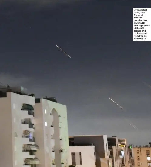  ?? AP ?? Over central Israel, Iron Dome air defence missiles head skyward to intercept some of the 300 drones and rockets fired from Iran on Saturday