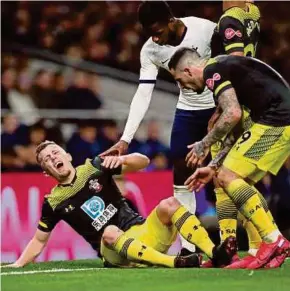  ?? REUTERS PIC ?? Southampto­n’s James Ward-Prowse reacts after sustaining an injury in their FA Cup match against Tottenham Hotspur.