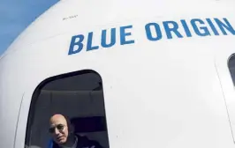  ?? Nick Cote, © The New York Times Co. file ?? Jeff Bezos in a mockup of the crew capsule of his space company, Blue Origin, during the 33rd Space Symposium in Colorado Springs in 2017.
