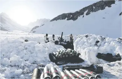  ?? Picture: AFP ?? French artillery soldiers prepare to fire mortars at Valloire, Mount Thabor, during a live firing exercise in the mountainou­s terrain of Cerces in the French Alps yesterday.