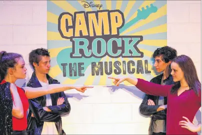  ?? STEVE CLARKE/THE GUARDIAN ?? Bridget Patterson and Daniel Wills square off against Sammy MacLean and Olivia Phillips in preparatio­n for Bluefield High School’s production of “Disney’s Camp Rock: The Musical,” premiering April 12.