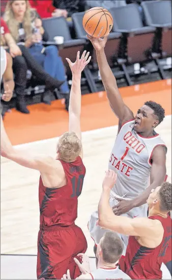  ?? [CRAIG MITCHELLDY­ER/THE ASSOCIATED PRESS] ?? Ohio State’s Jae’Sean Tate shoots over Stanford’s Michael Humphrey during the first half in Portland, Ore., on Friday night.
