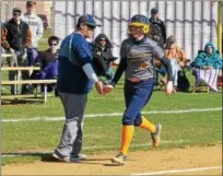  ?? THOMAS NASH — DIGITAL FIRST MEDIA ?? Upper Perkiomen’s Alyssa Sullivan (15) high-fives head coach Dean Sullivan while rounding third base on her home run during the fourth inning of Friday’s game.