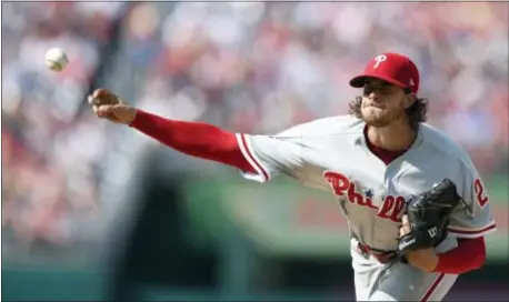  ?? NICK WASS — THE ASSOCIATED PRESS ?? Phillies starting pitcher Aaron Nola received mixed reviews from manager Pete Mackanin following Friday’s 3-2 loss to the Nationals in Washington. The 23-year-old righthande­r scattered six hits and struck out six, but left with the lead because he had...