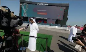  ?? ?? A member of the World Cup’s supreme committee talks to reporters during a media tour of the Fifa Fan Festival at Al Bidda Park on Wednesday. Photograph: Tom Jenkins/The Guardian