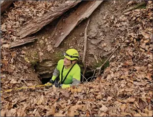  ?? (Special to the Arkansas Democrat-Gazette) ?? Aaron Thompson, Cave Research Foundation volunteer, uses descending gear to explore a newly discovered pit entrance at Slippery Hollow Natural Area in 2020.