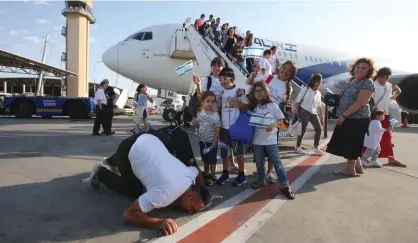  ?? (Marc Israel Sellem/The Jerusalem Post) ?? A GROUP OF new olim from France arrive at Ben-Gurion Airport yesterday.