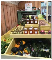  ??  ?? Local honey and homegrown produce are a few of the foods for sale at Margie Raimondo’s Urbana Farmstead.