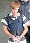  ?? AP ?? The accused Charleston church shooter, Dylann Roof, is escorted June 18 from the Cleveland County Courthouse in Shelby, N.C.