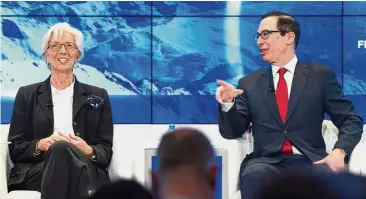  ??  ?? Weaker dollar: Mnuchin (right) gestures next to Lagarde during the World Economic Forum annual meeting in Davos. Mnuchin had said a weaker US dollar was good for the US. — AFP