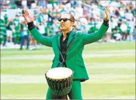  ?? Gary Miller Getty Images ?? MATTHEW McCONAUGHE­Y, 51, performs June 19 before an Austin FC soccer game. A poll of Texans found that 44% would vote for him if he ran for governor.