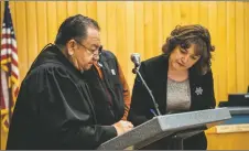  ?? ?? Lupe Martinez, right, is sworn in as the town’s new Finance Director by Judge Chavez on Tuesday (April 12).