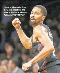  ??  ?? Spencer Dinwiddie signs new deal with Nets and then scores 27 in win over Wizards. PHOTO BY AP