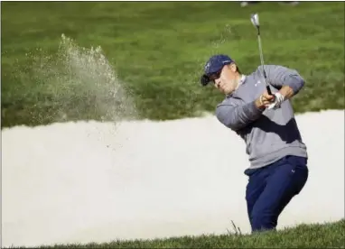  ?? ERIC RISBERG — THE ASSOCIATED PRESS ?? Jordan Spieth hits out of a bunker on the sixth fairway of the Pebble Beach Golf Links during the third round of the AT&T Pebble Beach National Pro-Am on Saturday.