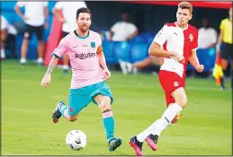  ??  ?? Barcelona’s Lionel Messi (left), vies for the ball with Girona’s Gumbau during the preseason friendly soccer match between Barcelona and Girona at the Johan Cruyff Stadium in
Barcelona, Spain on Sept 16. (AP)